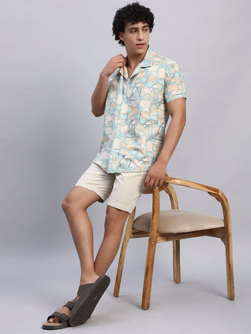 Full look: Men’s beige and pastel abstract print shirt paired with beige shorts and sandals — SMOKHEAD casual summer resortwear outfit