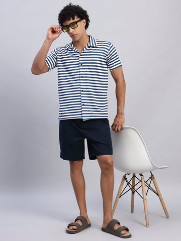 Full look: Men's navy blue and white striped shirt styled with navy shorts, sunglasses, and sandals — SMOKHEAD summer casual streetwear outfit