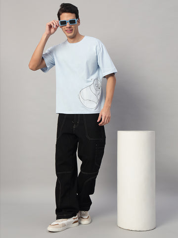 Full Look – SMOKHEAD Men’s Light Blue Oversized Graphic T-Shirt Styled with Black Cargo Jeans and Sneakers | Urban Streetwear Outfit