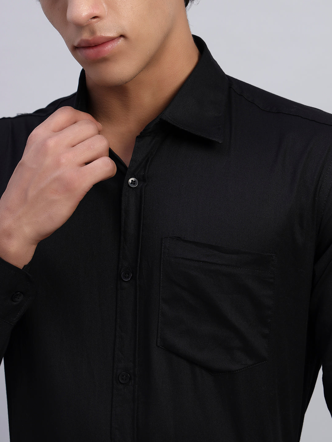 Close-up of men's black formal full-sleeve shirt fabric and button detailing — SMOKHEAD premium businesswear quality