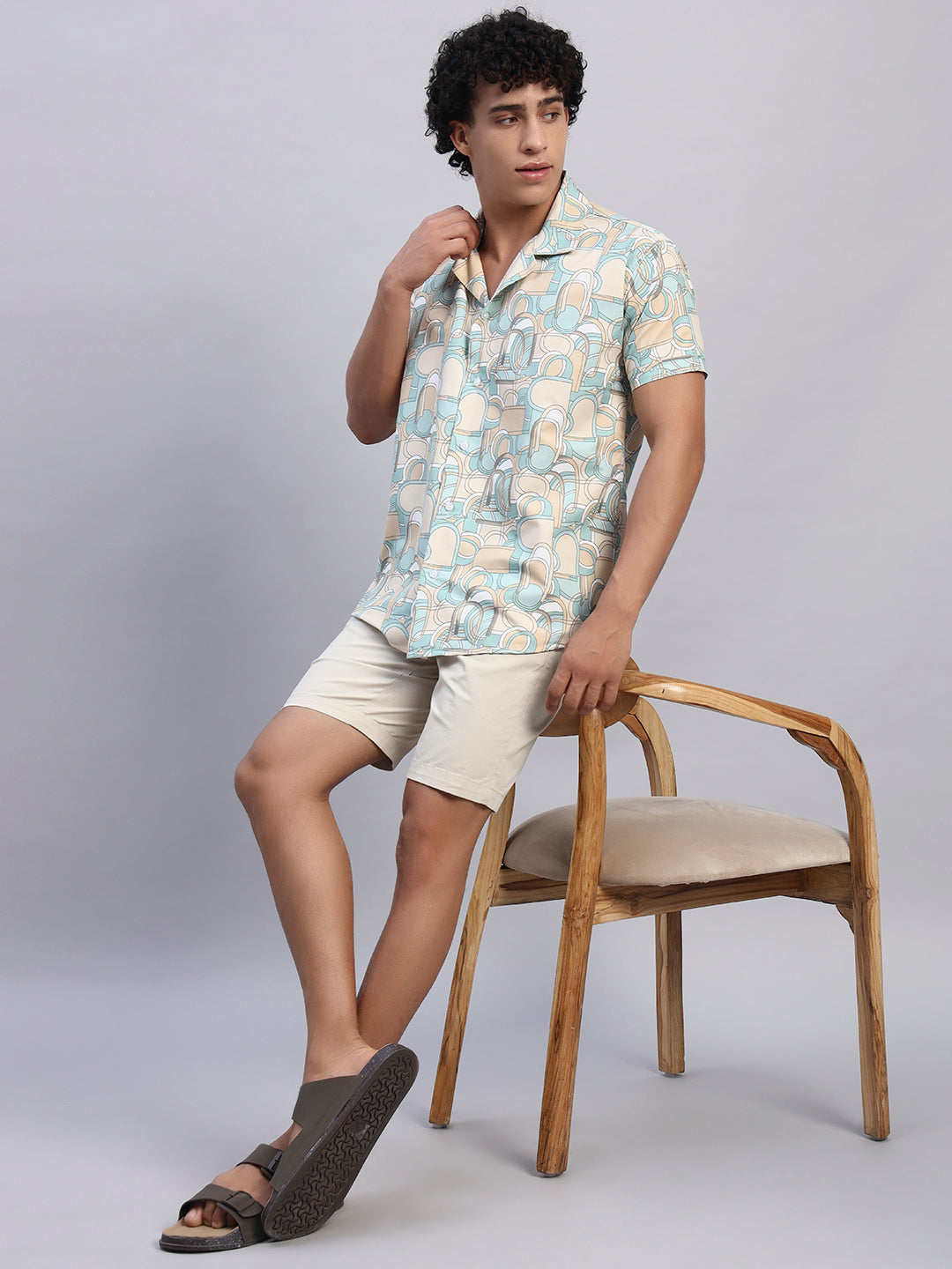 Full look: Men’s beige and pastel abstract print shirt paired with beige shorts and sandals — SMOKHEAD casual summer resortwear outfit