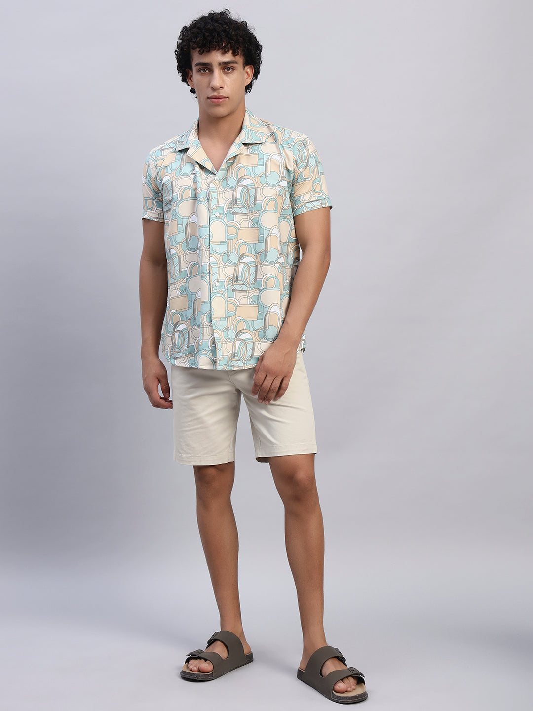 Full look: Men’s beige and pastel abstract print shirt paired with beige shorts and sandals — SMOKHEAD casual summer resortwear outfit