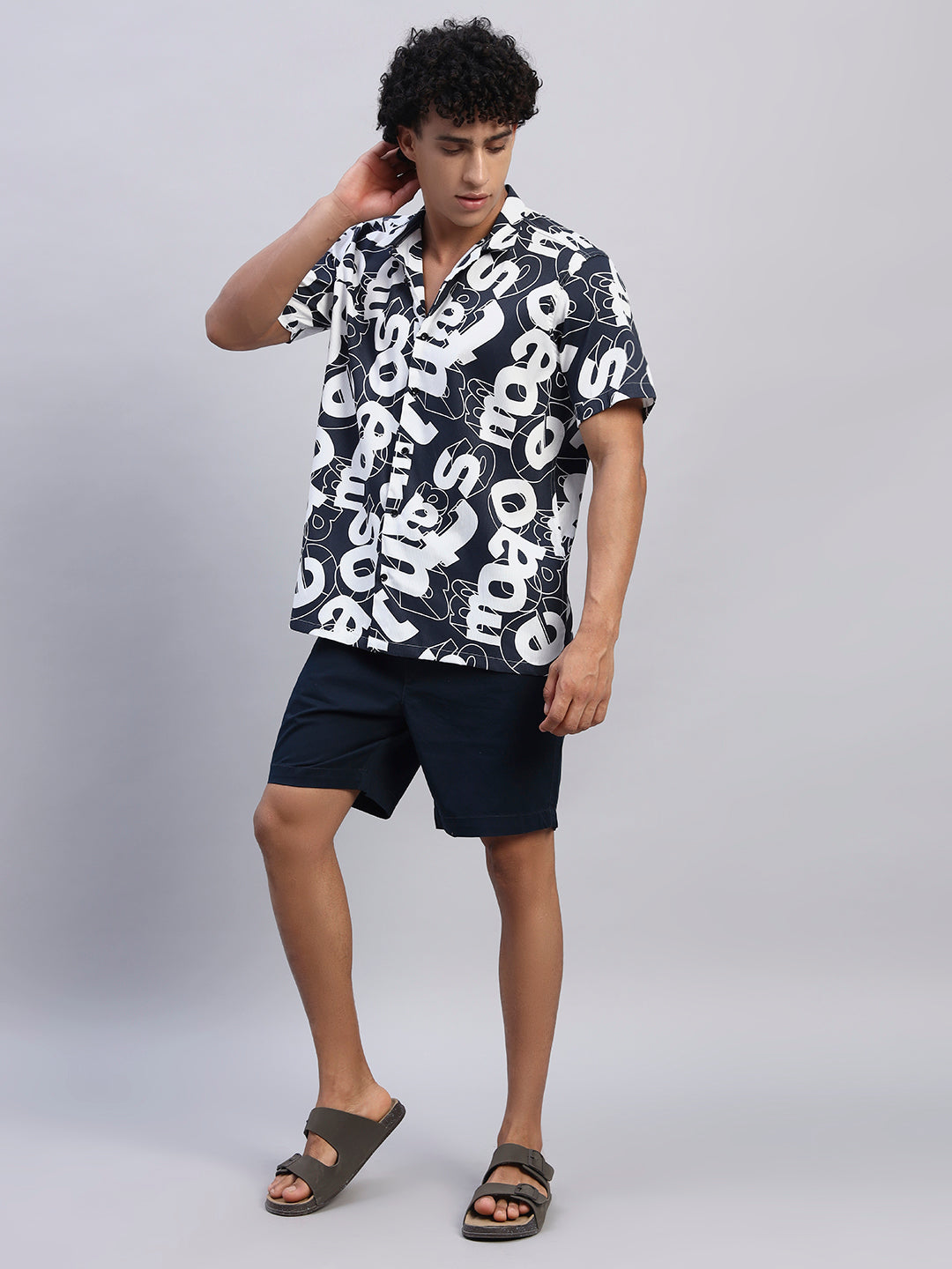 Full body view of male model wearing navy blue oversized printed shirt for men-Smokhead