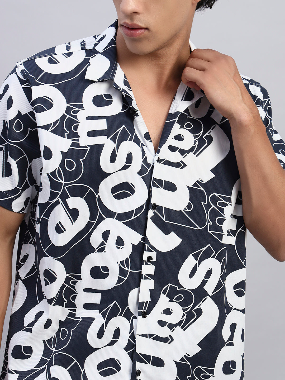 Close-up of fabric and print of navy blue oversized shirt-smokhead