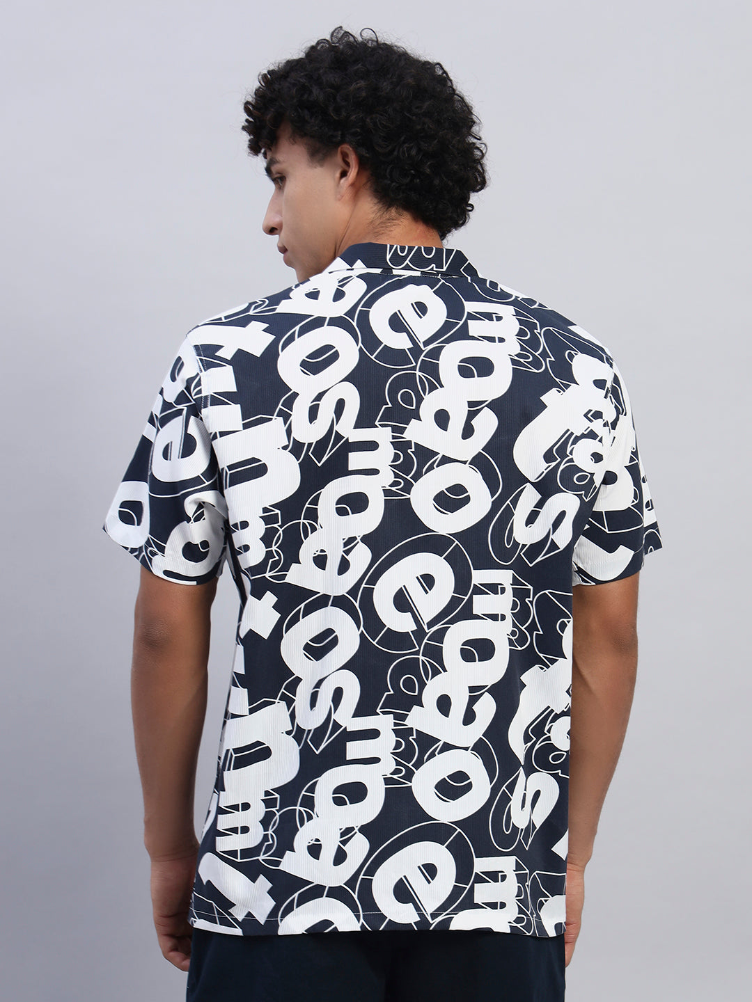 Model Back facing wearing navy blue oversized printed shirt for men from Smokhead