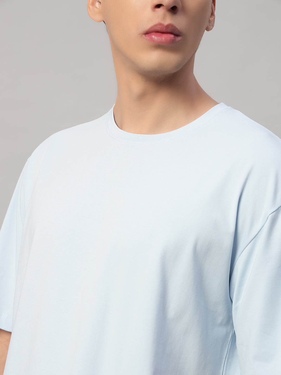Close-Up – Abstract Line Face Print on Light Blue Oversized T-Shirt by SMOKHEAD | High-Quality Cotton Detailing