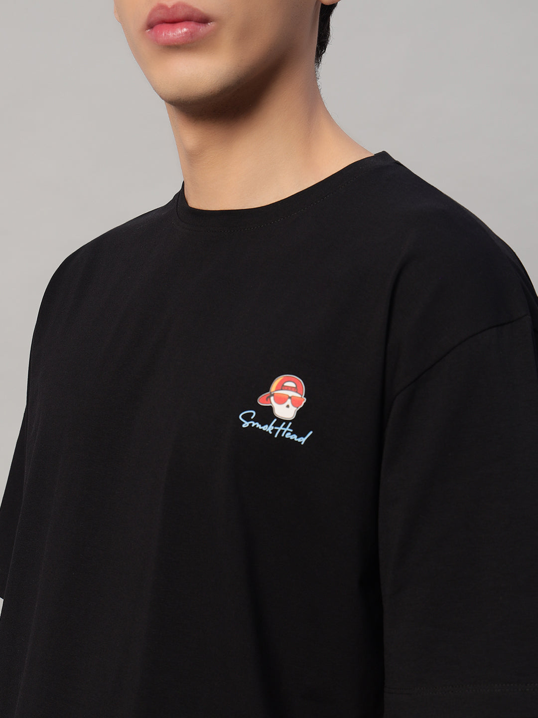 Left Side View – SMOKHEAD Black Oversized T-Shirt for Men with Casual Fit and Drop Shoulder Design - Logo on chest