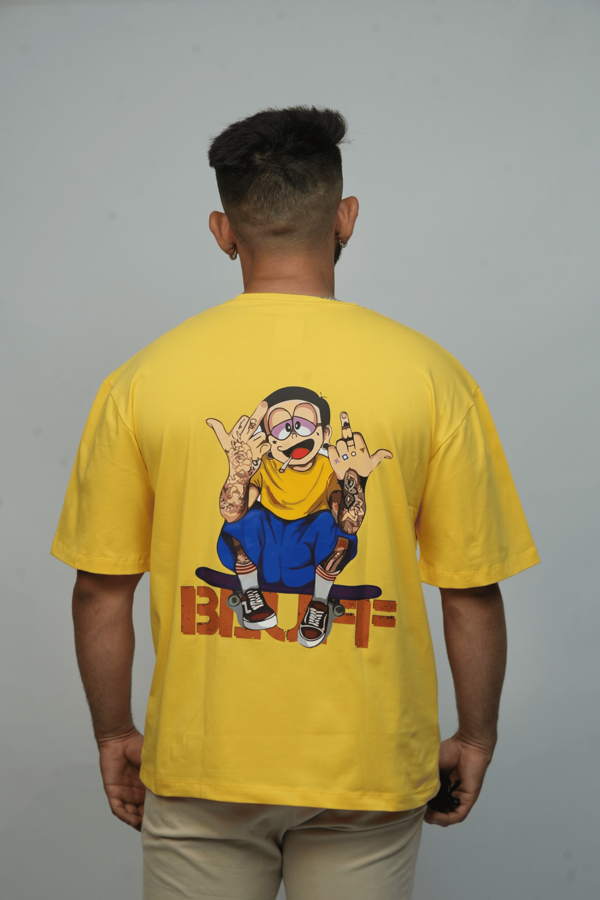 Back View – SMOKHEAD Yellow Oversized Men’s T-Shirt with Bold Cartoon Graphic and Street Style Tattoo Art - Bluff