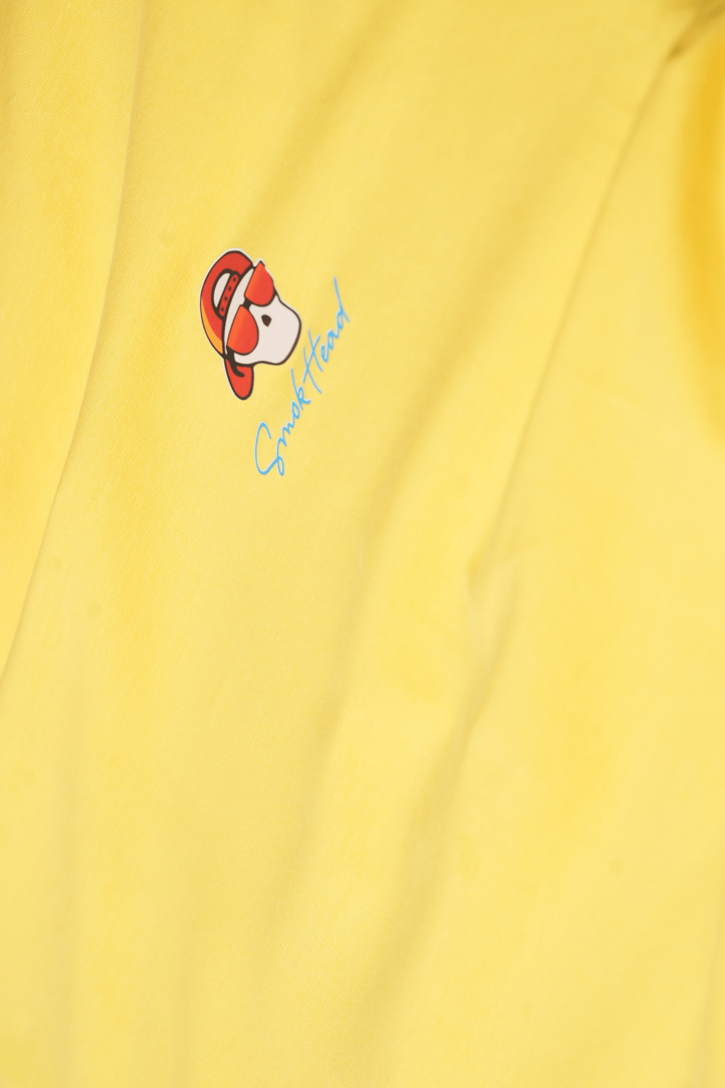 Close-Up – SMOKHEAD Yellow T-Shirt with Embroidered Mini Logo on Chest | Premium Cotton Finish