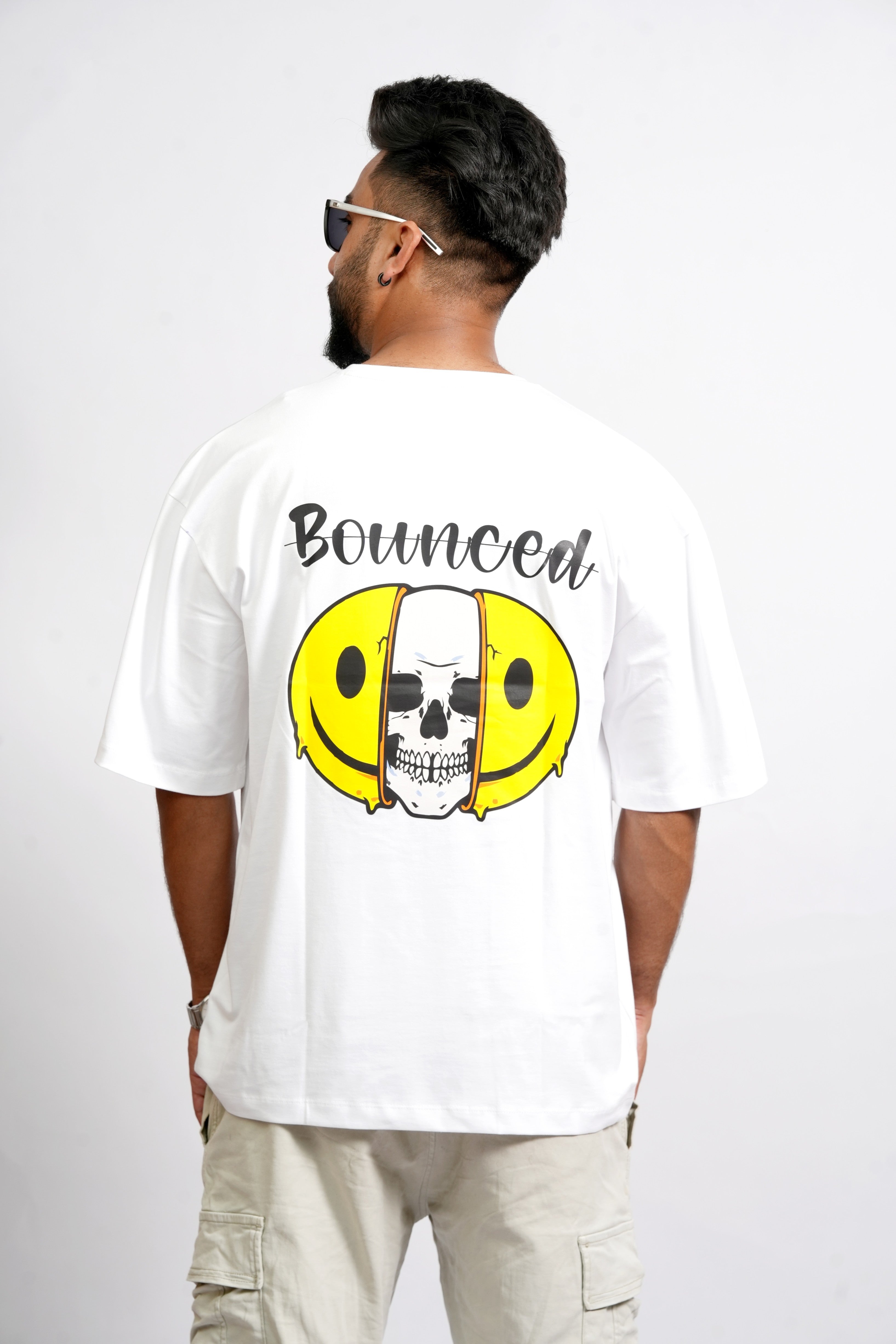 Back View – SMOKHEAD Men's White Oversized T-Shirt with 'Bounced' Skull and Smile Graphic Print